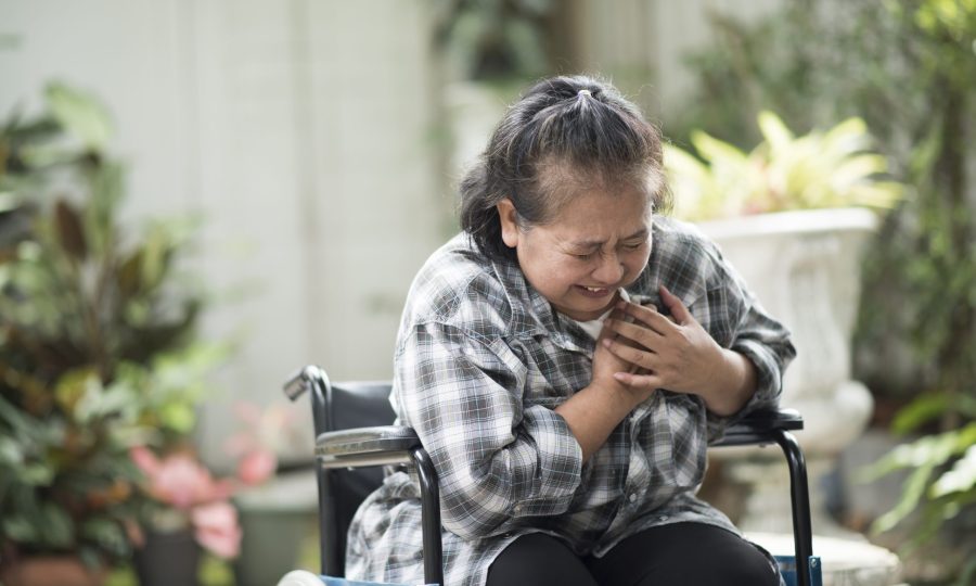 elderly woman have heart disease sitting on wheelchair